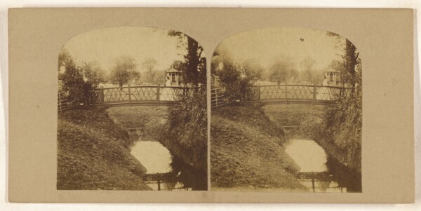 Unknown, [Woman crossing footbridge over stream]
