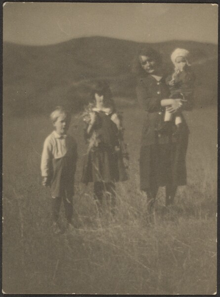 Louis Fleckenstein, [Woman and Three Children in Field]