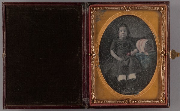 Unknown, [Portrait of a Seated Girl Holding a Flower]