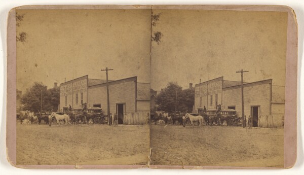 Unknown, [Exterior of Saint James Livery Sale and Commission Stables, J.H. McGinnis, Proprietor]