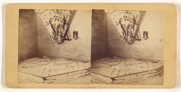 Unknown, [Room with odd ceiling, chair draped with patterned cloth, pair of woman's shoes hung on wall]