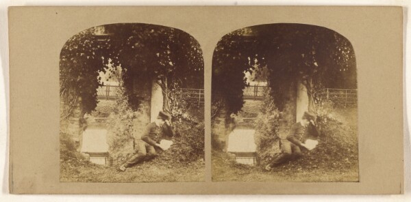 Unknown, [Boy on ground reading a letter or book]