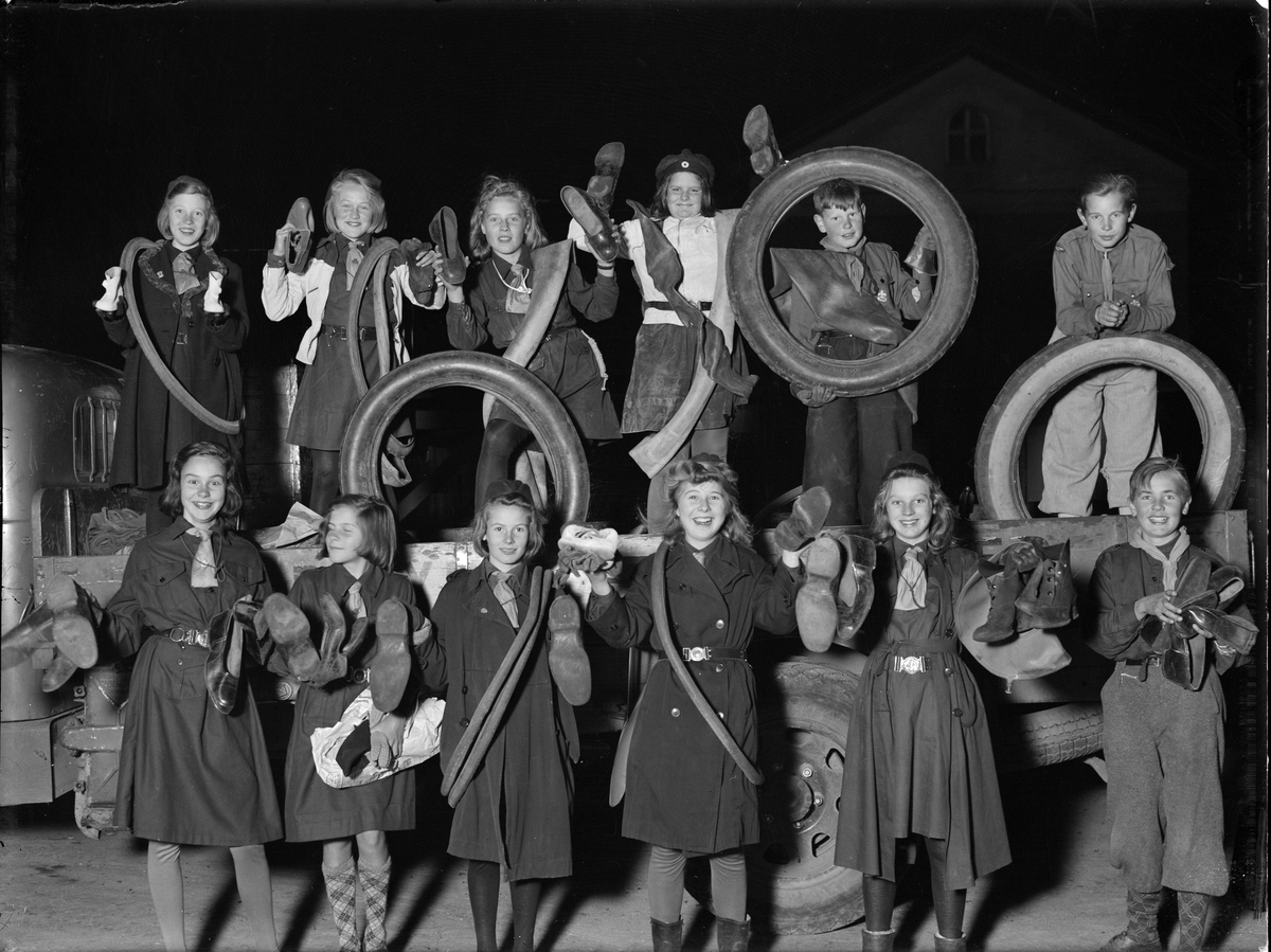 Paul Sandberg, “Happy Boy and Girl Scouts After Completed Hood,” Rubber Scrap Collection, Uppsala October 1941