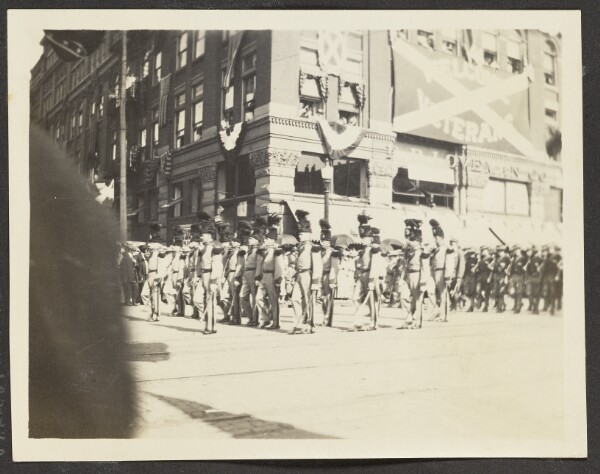Unknown, [View of Veterans Marching in Parade]