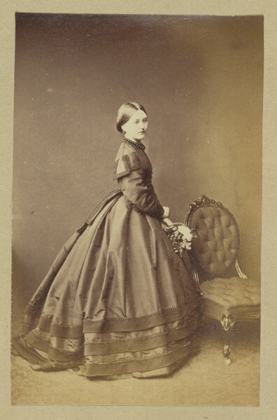Unknown, [Portrait of woman holding basket of flowers]