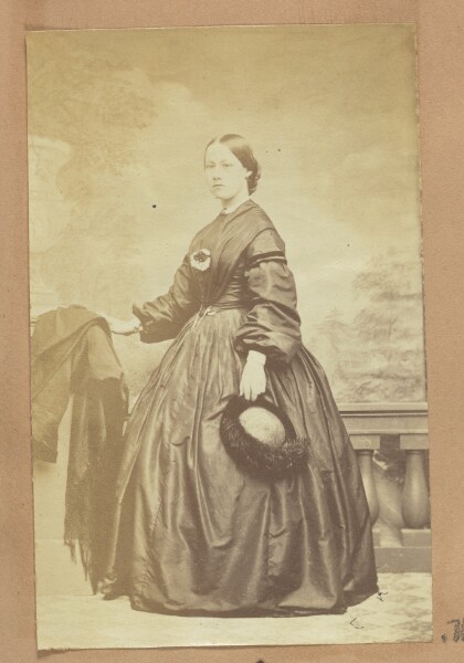 Unknown, [Portrait of woman holding fur-trimmed hat]
