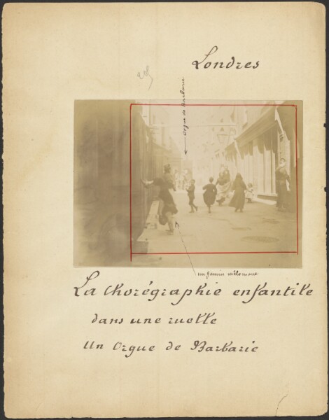 Unknown, [Children dancing to barrel organ in London alley]