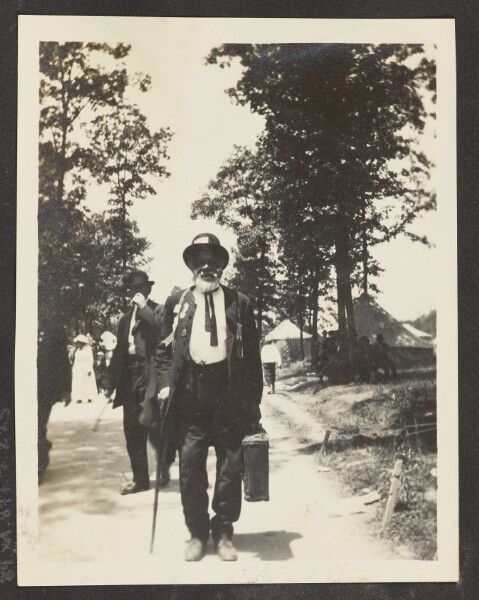 Unknown, [View of a Man Holding a Briefcase]