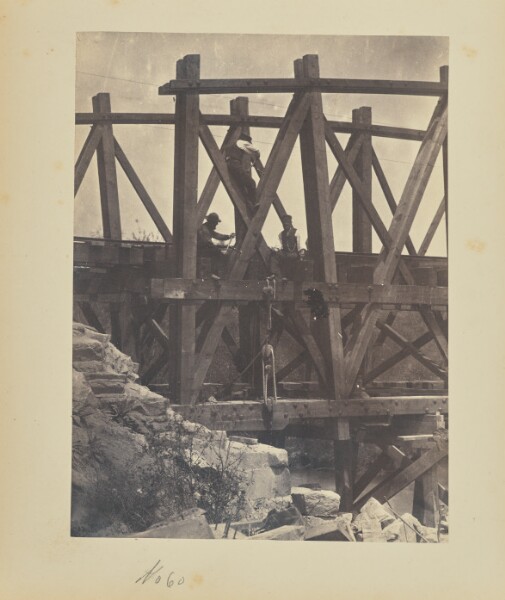 A. J. Russell, [Boring holes in a bridge truss for explosives]