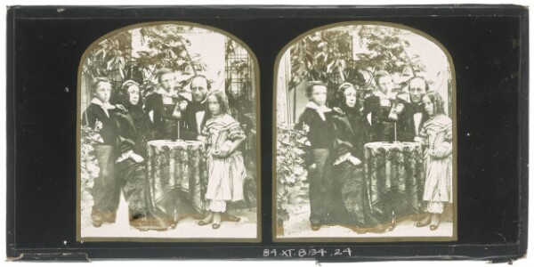 Unknown, [Unidentified family group: mother and father seated at a table, two boys and a girl standing with them]