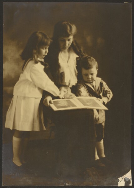 Louis Fleckenstein, [Woman and Children with Picture Book]