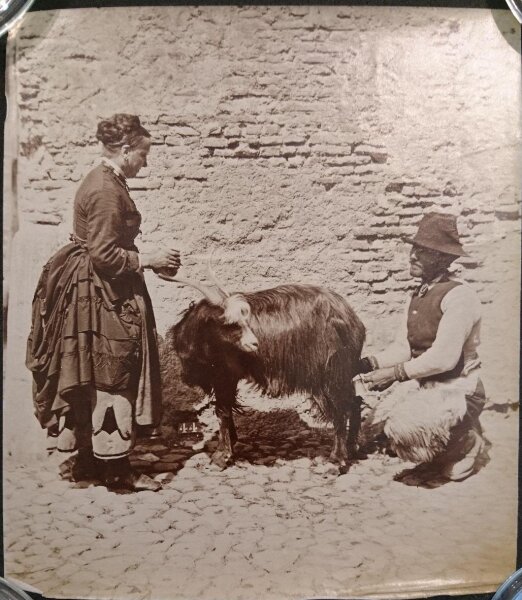 Unknown, Rural scene of a couple milking a goat, Italy