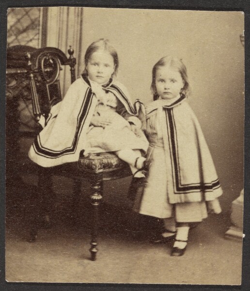 Unknown, [Portrait of Two Girls in Matching Capes]