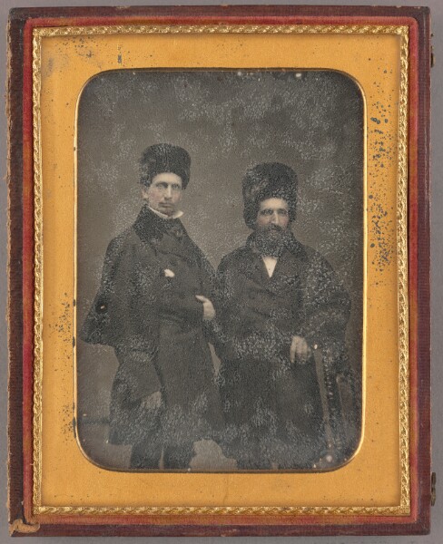 Unknown, [Portrait of Two Men in Overcoats and Fur Hats]