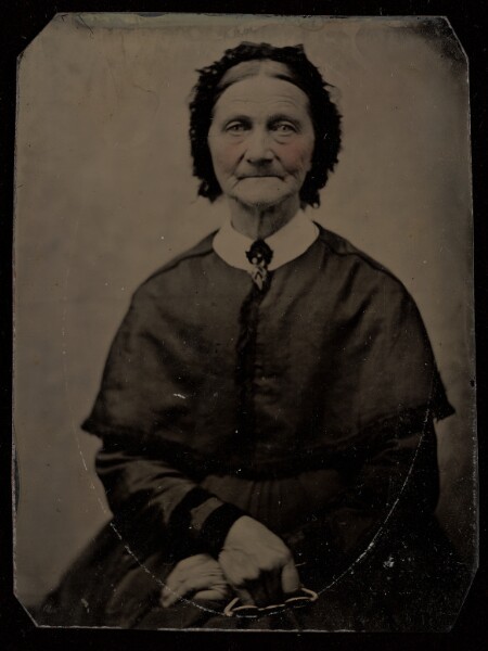 Unknown, [Portrait of a Seated Elderly Woman Holding Her Glasses]