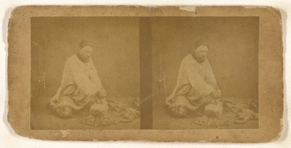 Unknown, [Man pounding on a stone]