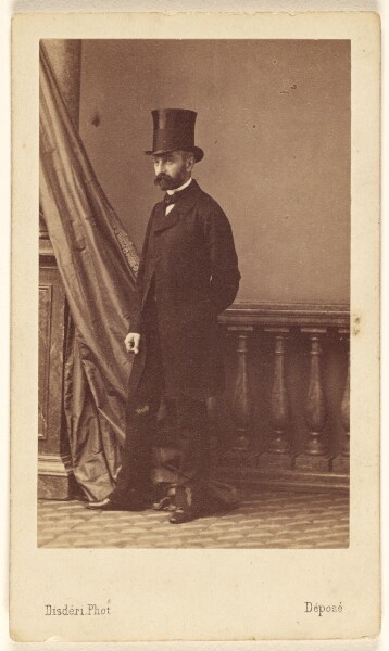 André Adolphe-Eugène Disdéri, [Unidentified bearded man wearing a top hat, standing]