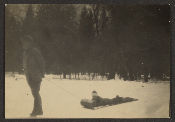 Louis Fleckenstein, [Man Pulling Child on Sled in Snow]
