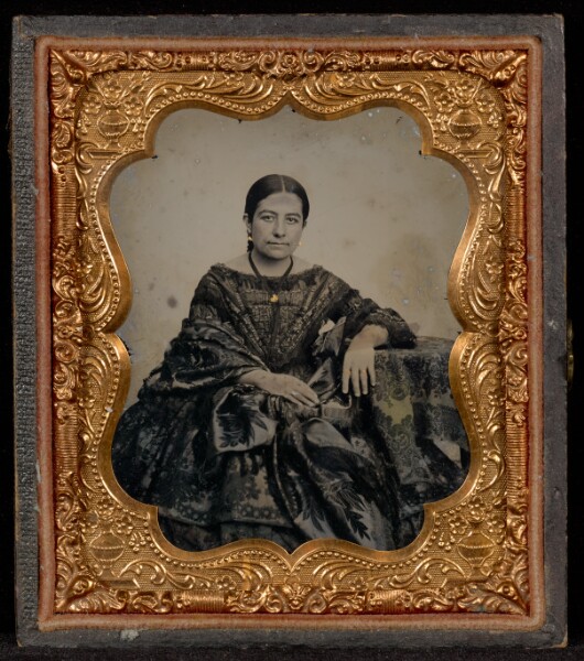 Unknown, [Portrait of a Woman in a Full Dark Dress Seated at a Table]