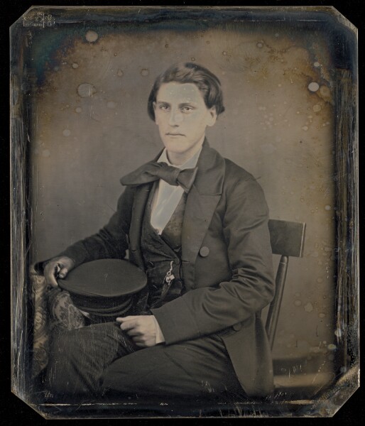 Unknown, [Portrait of a Seated Man Holding Cap]