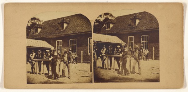Unknown, [Group of boys posed at a table outside, large house in background]