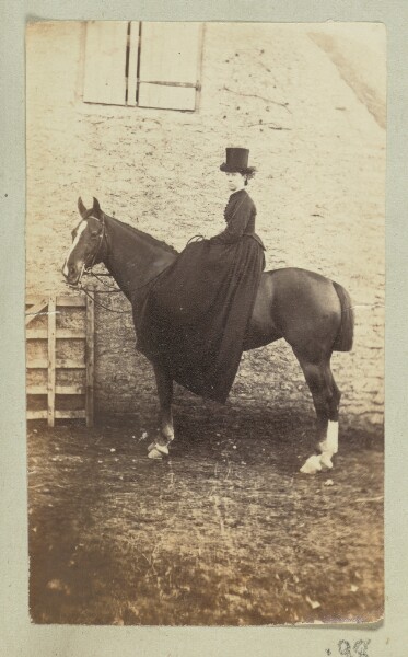 Unknown, [Equestrian portrait of a woman in a dark dress and hat]