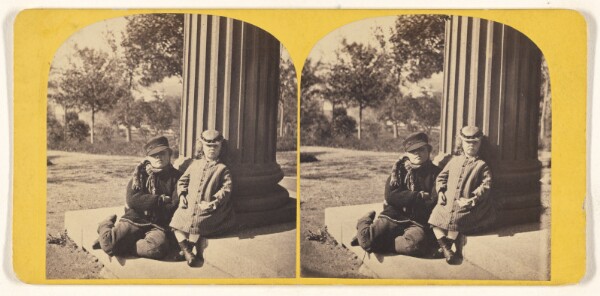 Unknown, [Two children posed outside near a column]