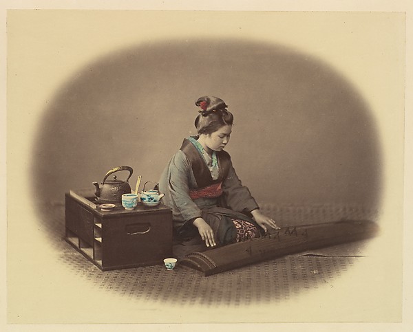 Felice Beato, [Woman with Tea Set Playing the Koto]