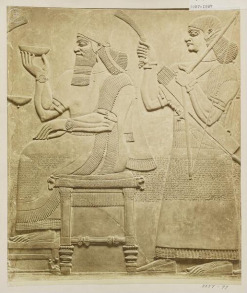 Unknown, Sculpture, relief of figure seated with attendant. London: British Museum