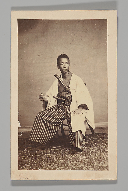 Unknown, [Studio Portrait: Man Seated with Swords]