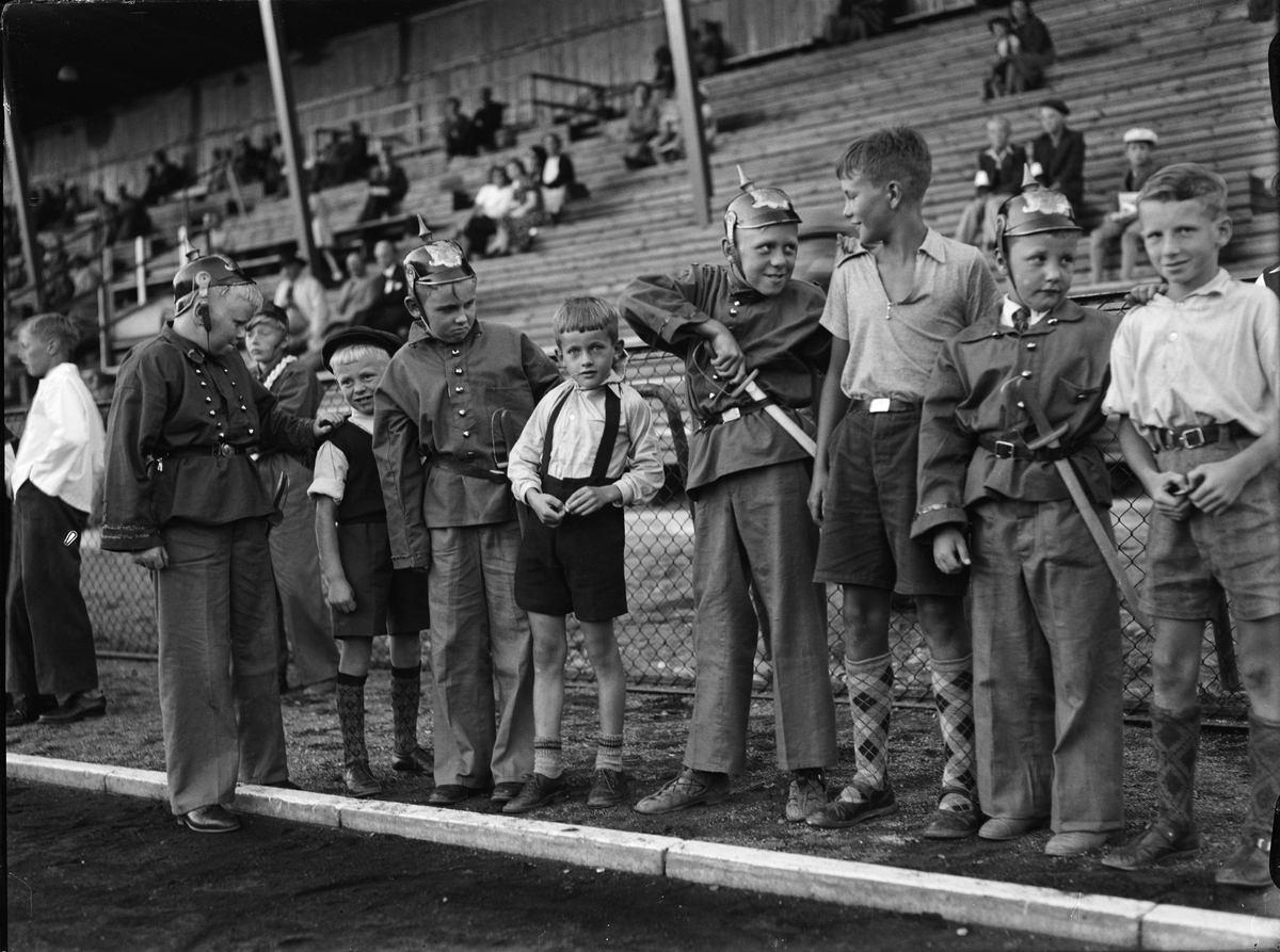 Paul Sandberg, Boys dressed for police officers at the Students Sports Hall at the inauguration of the Children’s Day