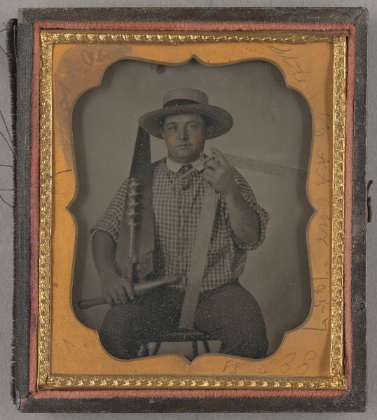 Unknown, [Portrait of a Seated Man with Carpentery Tools]