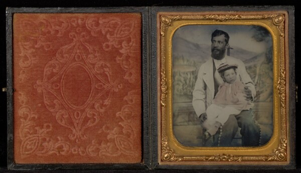 Unknown, [Portrait of a Man with a Young Boy in Hat on His Lap with a Painted Backdrop]