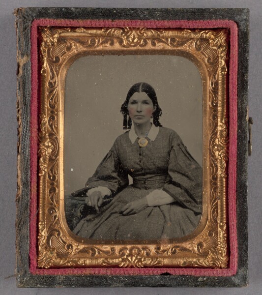 Unknown, [Portrait of a Seated Woman in Ringlets Wearing a Brooch]