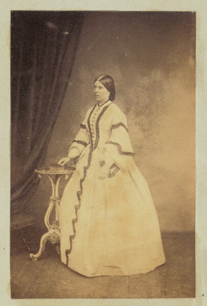 Unknown, [Portrait of woman in dress with striped sleeves]