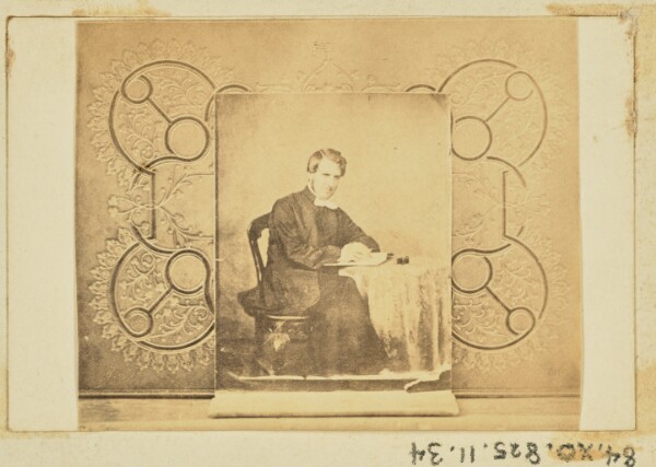 Unknown, [Portrait of a man seated at a table]
