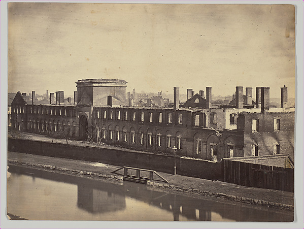 Alexander Gardner, [Ruins of the State Arsenal from the Canal, Richmond, Virginia]