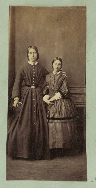 Unknown, [Portrait of woman with arm around girl]