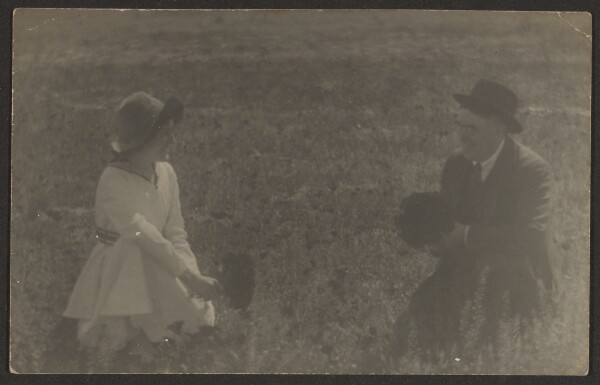 Louis Fleckenstein, [Fleckenstein and Daughter Sitting in Field with Flowers]