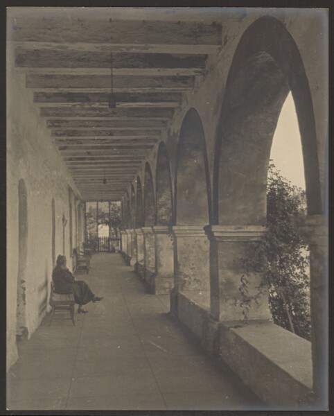 Louis Fleckenstein, [Woman Sitting in Mission Hallway]
