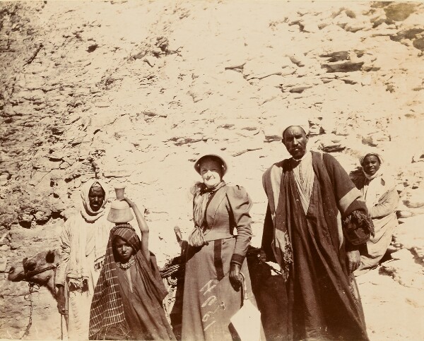 Unknown, [Woman with men and camel]