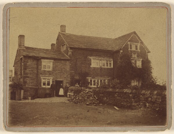 Unknown, [View of unidentified large house with people at front door]