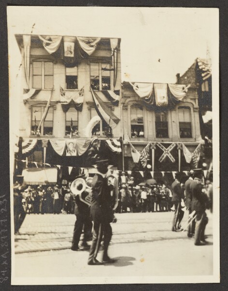 Unknown, [View of Band Marching in Parade]