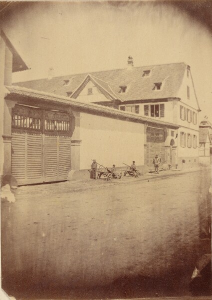 Unknown, [Figures with carts along road]