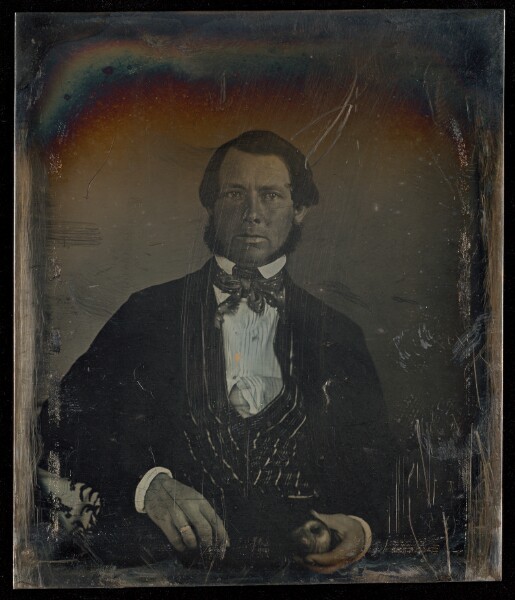 Unknown, [Portrait of a Seated Man with Muttonchoip Whiskers Holding an Apple]