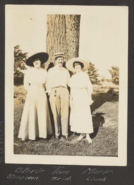 Unknown, [A Man and Two Women Posing in Front of a Tree]