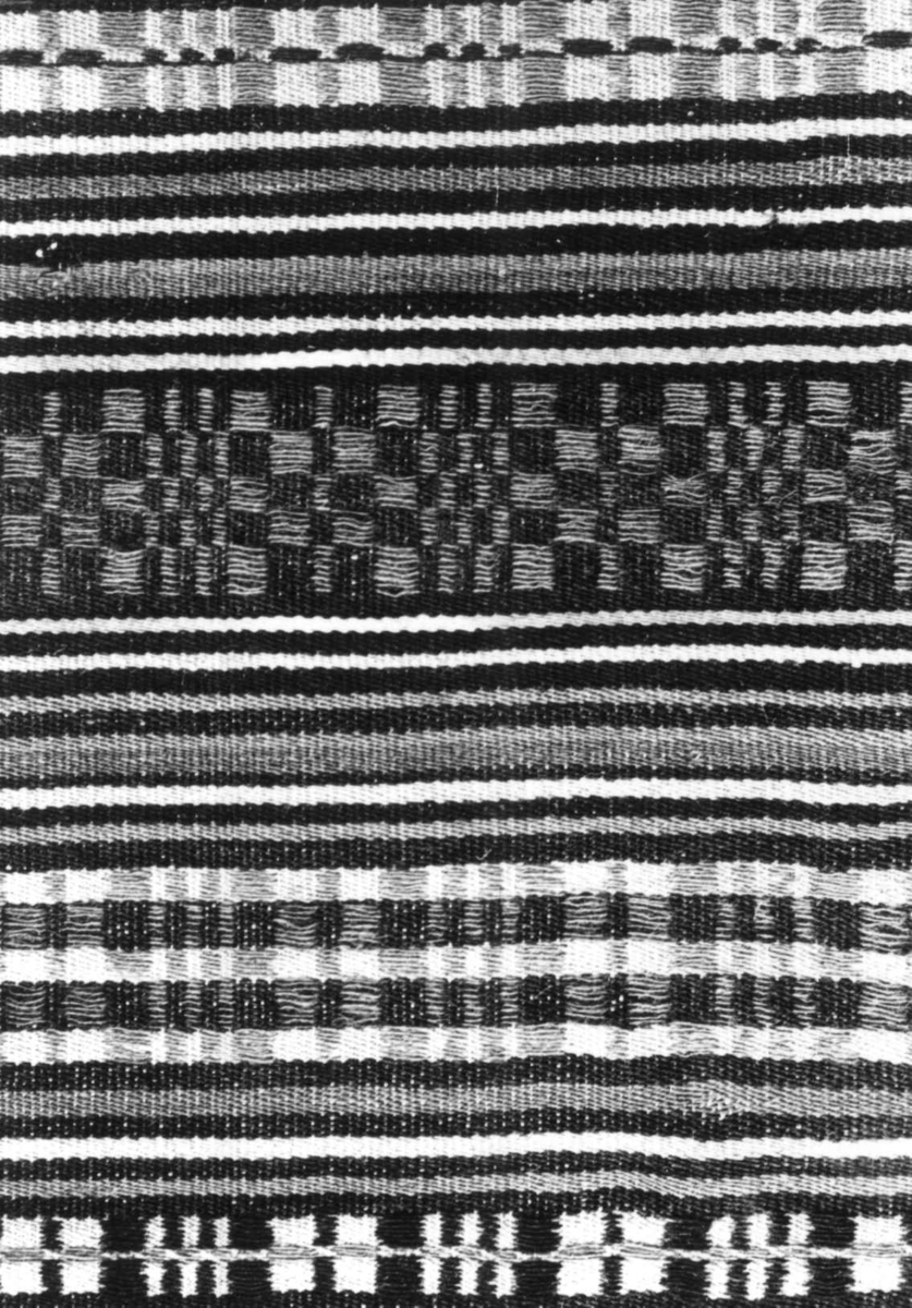Anna Grostøl, Iveland, Vest-Agder 1941. Teppe, detalj av tavlebragd fra 1830-tallet.