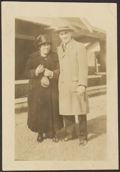 Louis Fleckenstein, [Mrs. Fleckenstein and Young Man Standing Before Building]