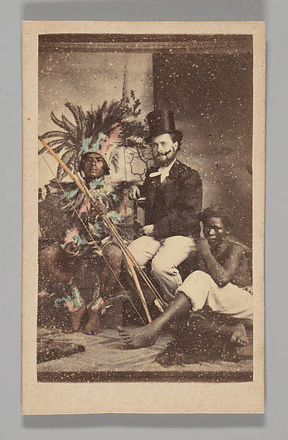 Unknown, [Studio Portrait: Man Wearing Top Hat Seated with 2 Indigenous People]