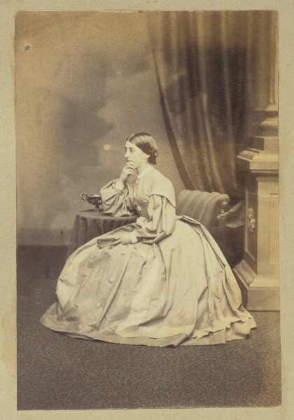 Unknown, [Portrait of pensive woman holding book]